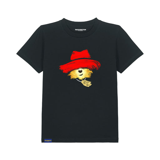 A black short-sleeve crewneck t-shirt featuring a graphic of a bear wearing a red hat, with the brand name 'Paddington The Musical' printed inside the collar.
