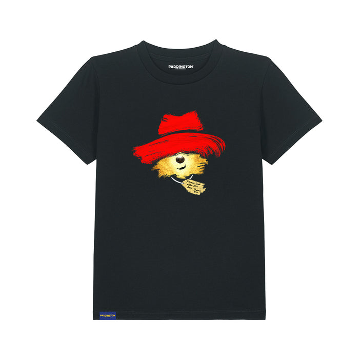 A black short-sleeve crewneck t-shirt featuring a graphic of a bear wearing a red hat, with the brand name 'Paddington The Musical' printed inside the collar.