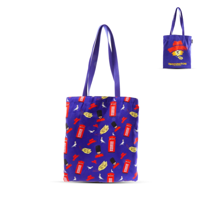 Blue tote bag with colorful London telephone booth box pattern on a white background