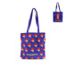 Blue tote bag with Paddington Bear pattern and Paddington The Musical logo on a white background