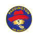 Circular logo for 'Paddington the Musical' with a bear wearing a red hat on a blue background.