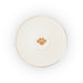 A white ceramic plate or saucer with a thin gold rim and a small gold paw print motif in the center, shown from a top-down view on a white background.