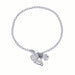 Silver bracelet with paw print charm on a white background