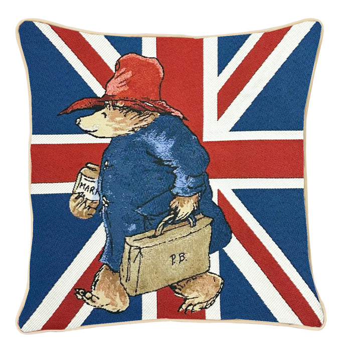 A square paddington cushion cover with union jack motif and bear carrying marmalade and suitcase