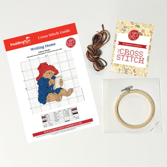 Paddington Cross stitch kit with pattern, thread, and hoop on a light background
