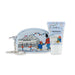 A light blue Paddington-themed zip pouch with a silver keychain, shown next to a matching light blue hand cream tube by Cath Kidston. The packaging features illustrations of Paddington Bear, a london soldier, and Buckingham Palace.