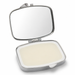 An open silver metal compact case with a mirror on the lid and a pale cream-colored balm or cream inside, shown on a white background.