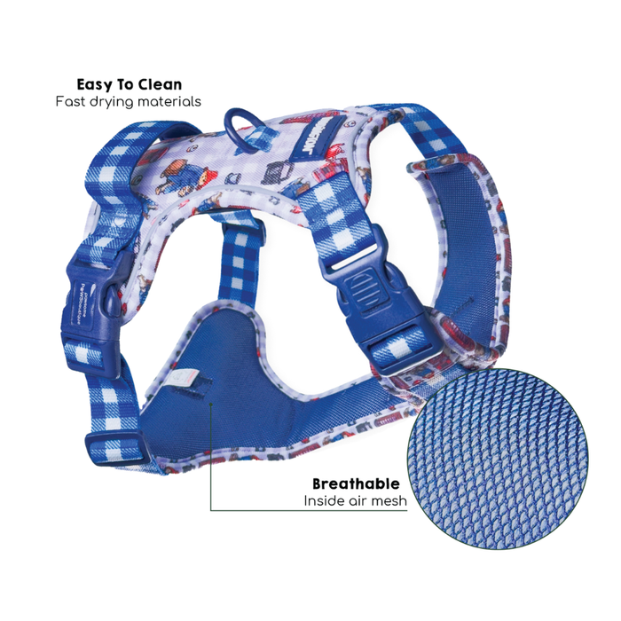 A blue patterned dog harness with adjustable plastic buckles, shown on a white background with feature callouts: 'Easy To Clean Fast drying materials' and 'Breathable Inside air mesh,' plus a circular inset of the mesh texture.
