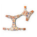 Decorative dog harness with cartoon character pattern on a white background