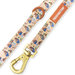 Dog leash with Paddington Bear design and gold clasp on a white background