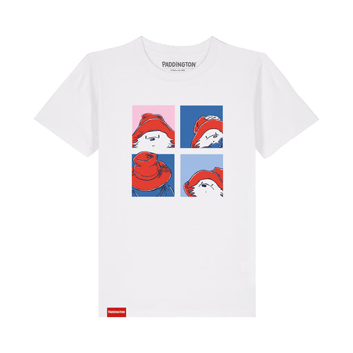 A white short-sleeve crewneck t-shirt featuring a four-panel graphic print of a cartoon bear wearing a red hat in a pop-art style. The brand name 'PADDINGTON' is printed inside the collar, and a small red tag is visible near the bottom left hem.