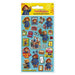 A package of Paddington-themed reusable stickers on a light blue backing card. The stickers feature multiple illustrations of Paddington Bear in his blue coat, along with London scenes, a red double-decker bus, a yellow cab, and other Paddington-related items.