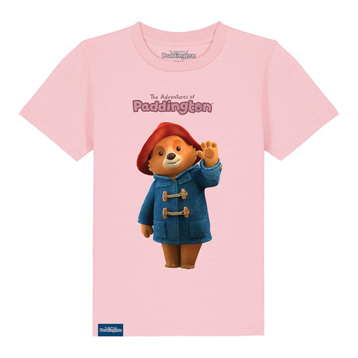A pink kids' T-shirt with a graphic of Paddington Bear in a red hat and blue coat on a pink background, with the text 'The Adventures of Paddington'.