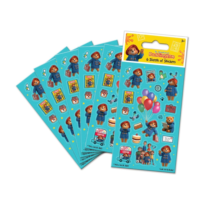 Six sheets of Paddington-themed stickers fanned out on a white background, with the top sheet showing a yellow header card labeled 'Paddington 6 Sheets of Stickers'.