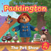 Cover of a children's picture book titled 'The Adventures of Paddington: The Pet Show' featuring cartoon illustrations of Paddington Bear and other animals, with a festive background.