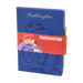 Blue notebook an gold pen with Paddington Bear design and red band featuring Paddington Bear holding a jar of marmalade.