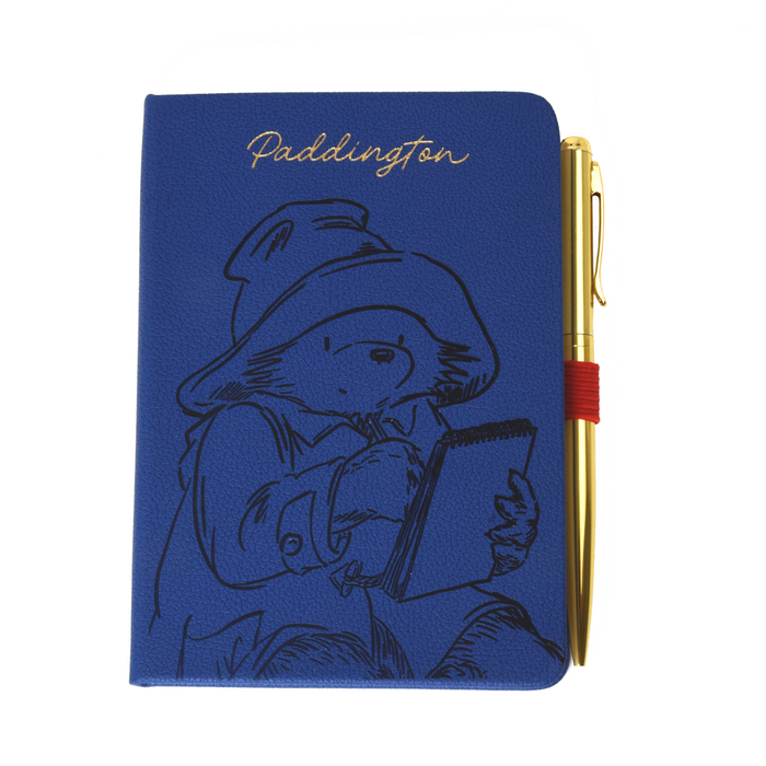 Blue notebook with Paddington Bear illustration and a pen on a white background