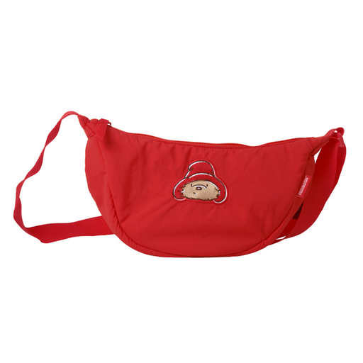 Red paddington crossbody bag with a cartoon character on a white background