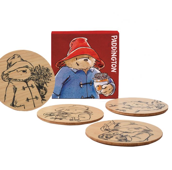 Set of 4 bamboo coasters with Paddington Bear illustrations on a white background