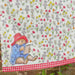 Video of a summer washing line featuring a paddington floral tea towel in front of a brick wall and a close up of the kitchen towel folded on the tablescape
