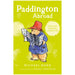 Book cover of 'Paddington Abroad' featuring an illustration of Paddington Bear wearing a hat and holding a map, against a green background.