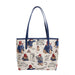 A beige tote bag featuring a tapestry design with characters and a cityscape, accented with faux leather trim and blue handles.
