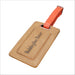 Brown leather luggage tag with 'Paddington Bear' text and orange strap on a white background