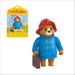 Paddington bear toy figure with blue coat and red hat, next to packaging