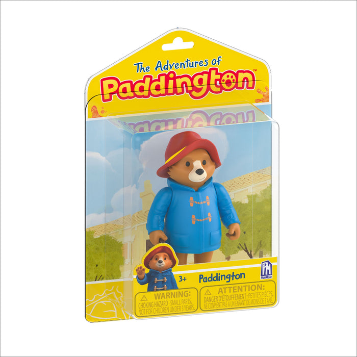 Paddington bear toy figure in packaging with 'The Adventures of Paddington' text.